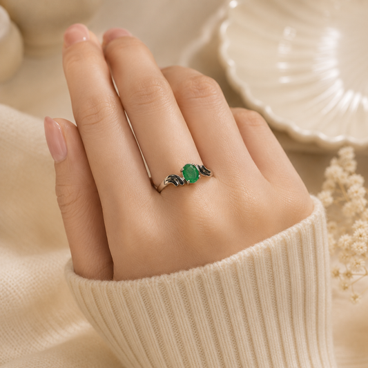 Curved Emerald Ring crafted in 925 Sterling Silver with a green oval cut Emerald gemstone.