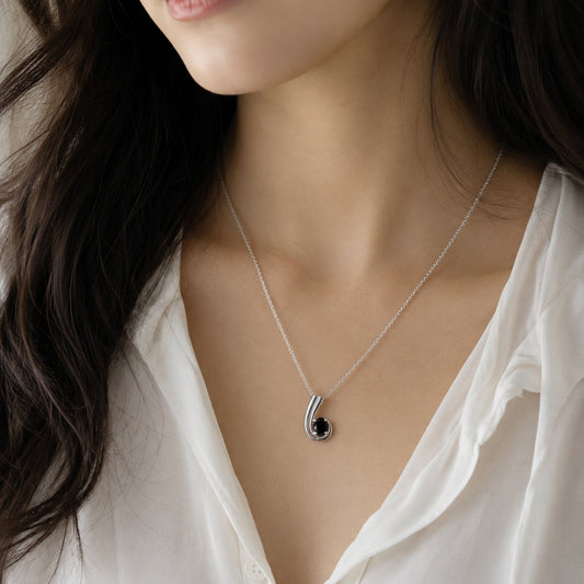 Black Onyx Pendant in 925 Sterling Silver with oval-cut black gemstone.
