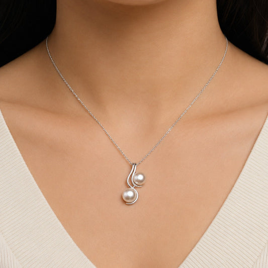 Pearl Drop Pendant in 925 Sterling Silver with lustrous white pearls.