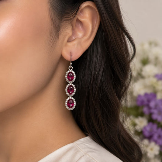 Ruby Triple Drop Earrings in 925 Sterling Silver with oval-cut red gemstones and halo setting.