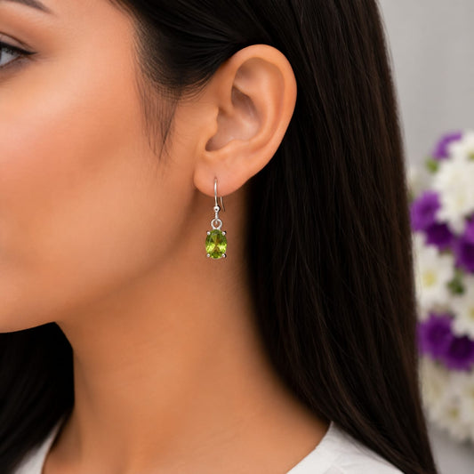 925 Sterling Silver Solitaire Drop Earrings featuring natural oval-cut Peridot gemstones in a classic minimalist setting.