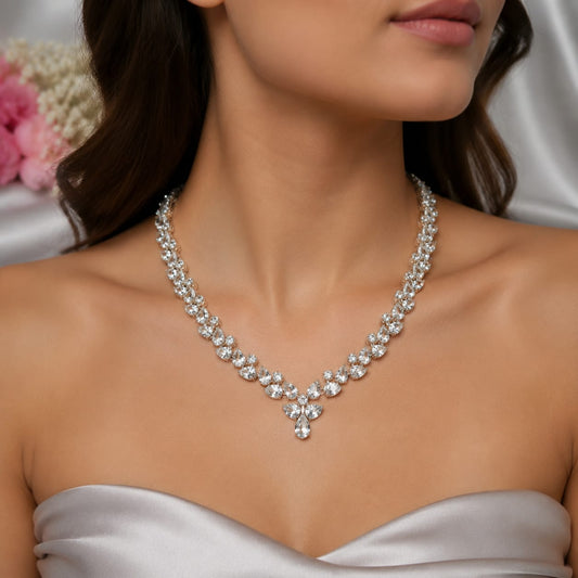 White Topaz Floral Statement Necklace in 925 Sterling Silver featuring pear-cut and round White Topaz gemstones arranged in a floral vine design.