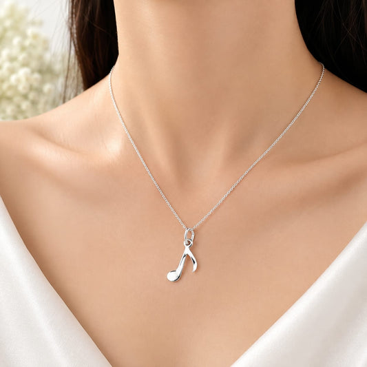 925 Sterling Silver Musical Note Charm Pendant on White Satin Background