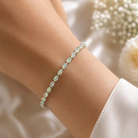 White Opal Tennis Bracelet in 925 Sterling Silver worn on wrist