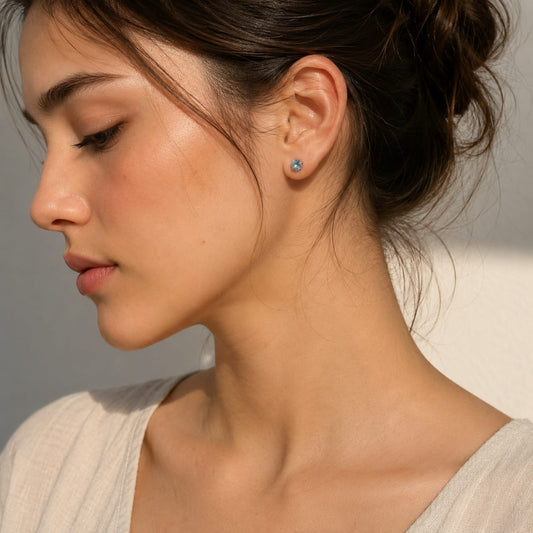 Round Blue Topaz stud earrings in 925 Sterling Silver with six-prong setting