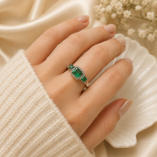 Three Stone Emerald Ring crafted in 925 Sterling Silver with three green Emerald gemstones.