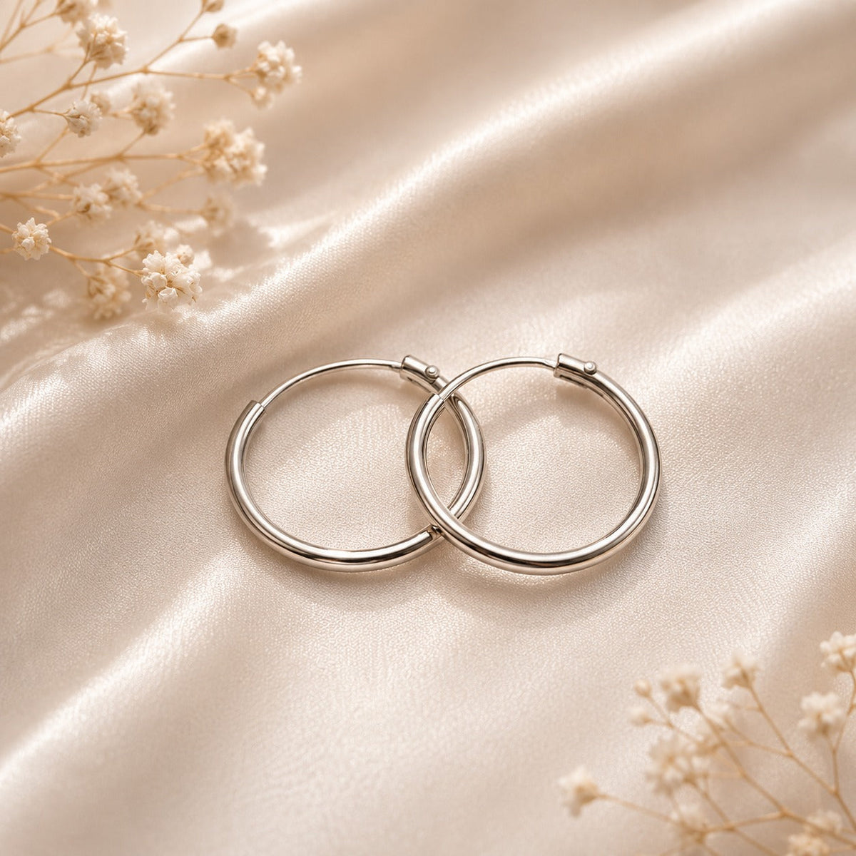 Modern sterling silver hoop earrings collection featuring timeless and versatile designs.