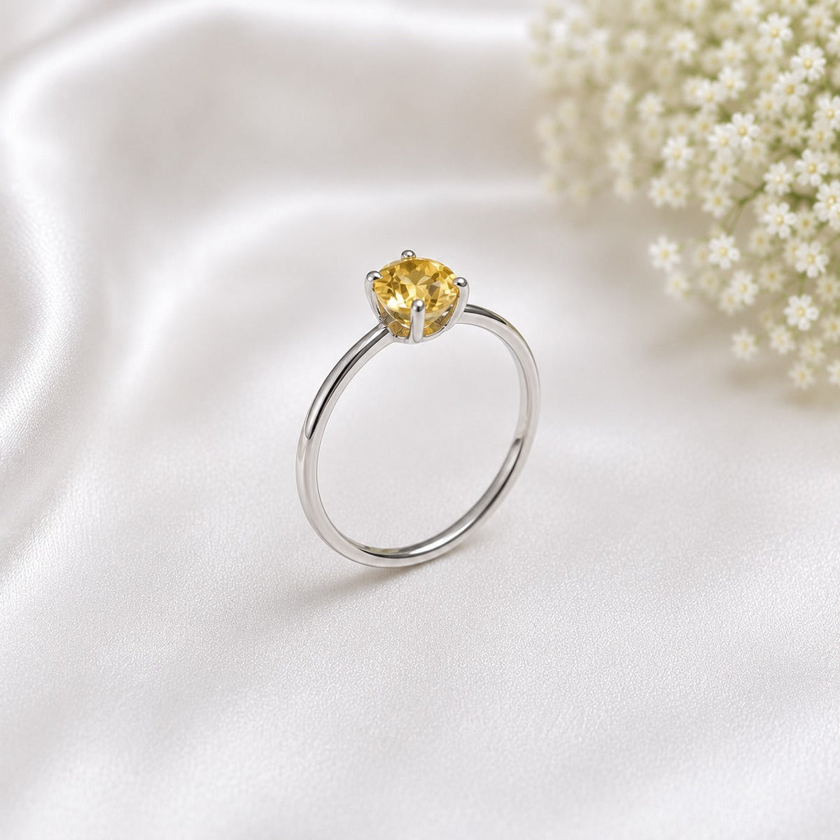 Solitaire Citrine Ring crafted in 925 Sterling Silver featuring a natural round cut Citrine gemstone in a four-prong setting.
