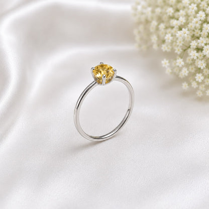 Solitaire Citrine Ring crafted in 925 Sterling Silver featuring a natural round cut Citrine gemstone in a four-prong setting.