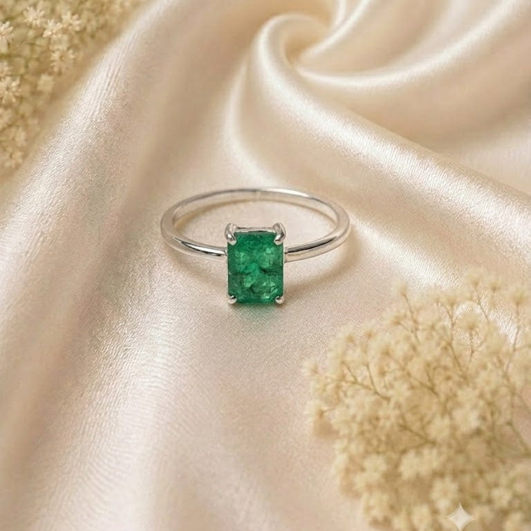 Rectangular Emerald Solitaire Ring crafted in 925 Sterling Silver with a green rectangular Emerald gemstone.
