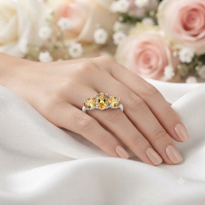 Three Stone Citrine Ring crafted in 925 Sterling Silver featuring three oval cut Citrine gemstones.