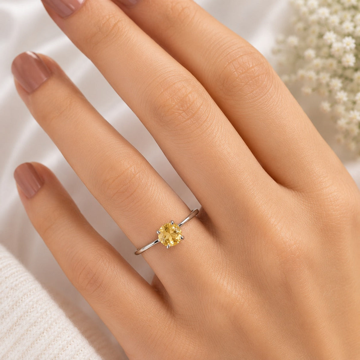 Solitaire Citrine Ring crafted in 925 Sterling Silver featuring a natural round cut Citrine gemstone in a four-prong setting.