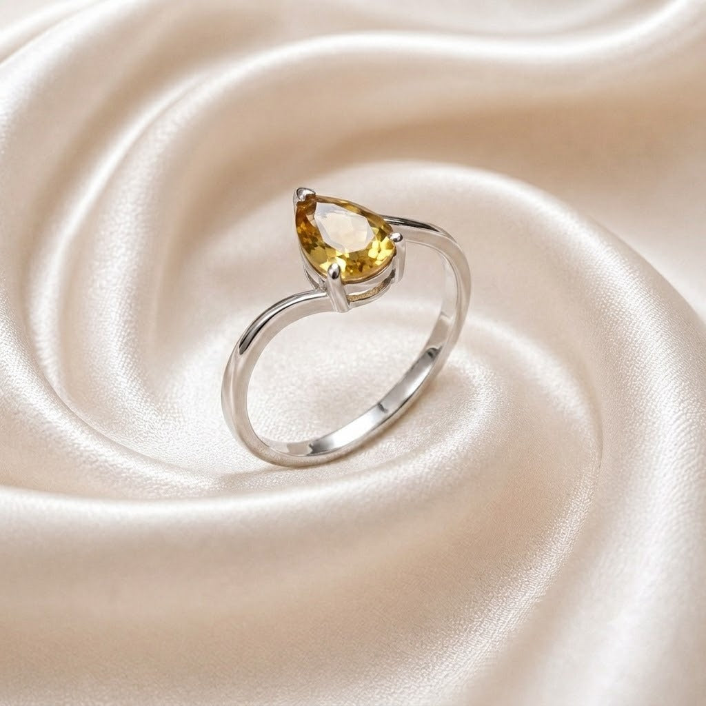 Pear Citrine Solitaire Ring crafted in 925 Sterling Silver with a natural pear cut Citrine gemstone.