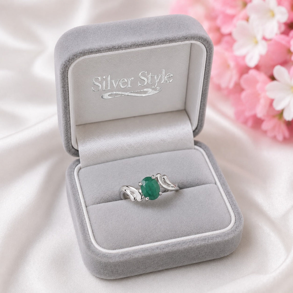 Curved Band Emerald Ring crafted in 925 Sterling Silver with a green oval cut Emerald gemstone.