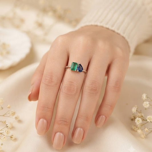 Emerald and Sapphire Ring crafted in 925 Sterling Silver with green and blue gemstones.
