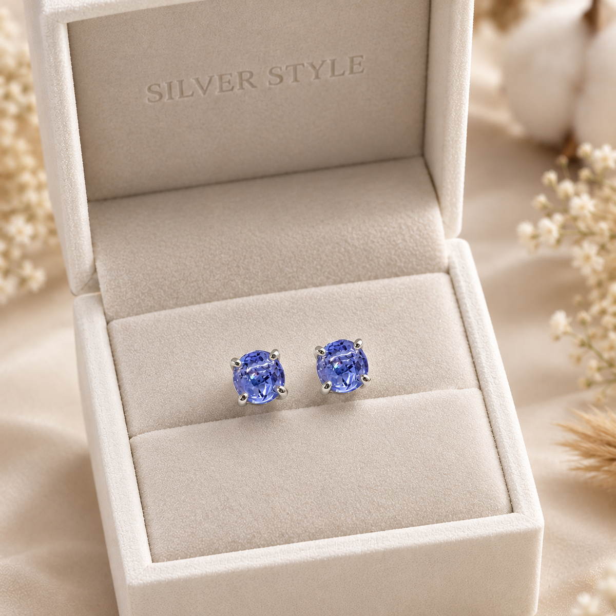 Round Tanzanite stud earrings in 925 sterling silver by Silver Style