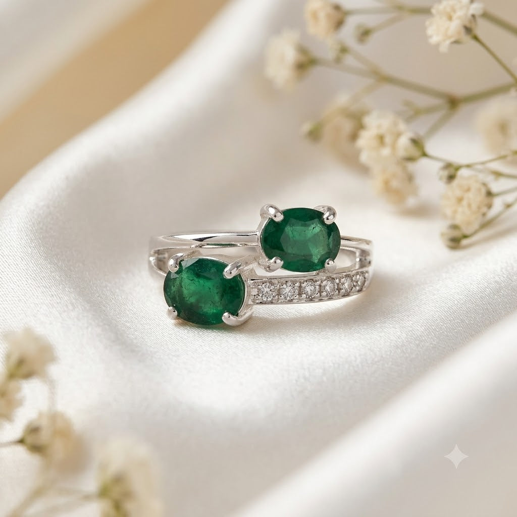 Twin Emerald Ring crafted in 925 Sterling Silver with two green Emerald gemstones.