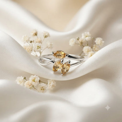 Triple Citrine Floral Ring crafted in 925 Sterling Silver with three yellow Citrine gemstones.