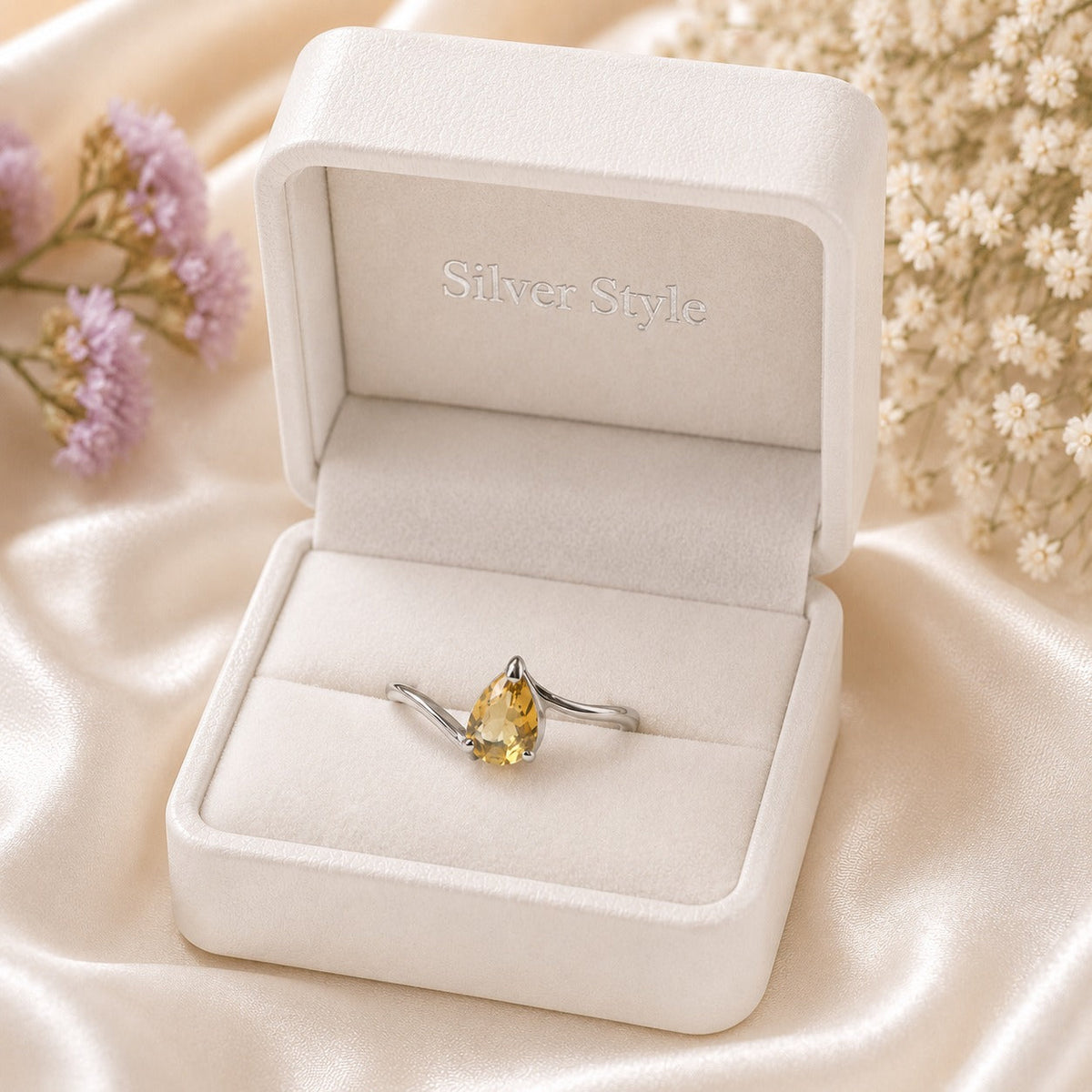 Pear Citrine Solitaire Ring crafted in 925 Sterling Silver with a natural pear cut Citrine gemstone.