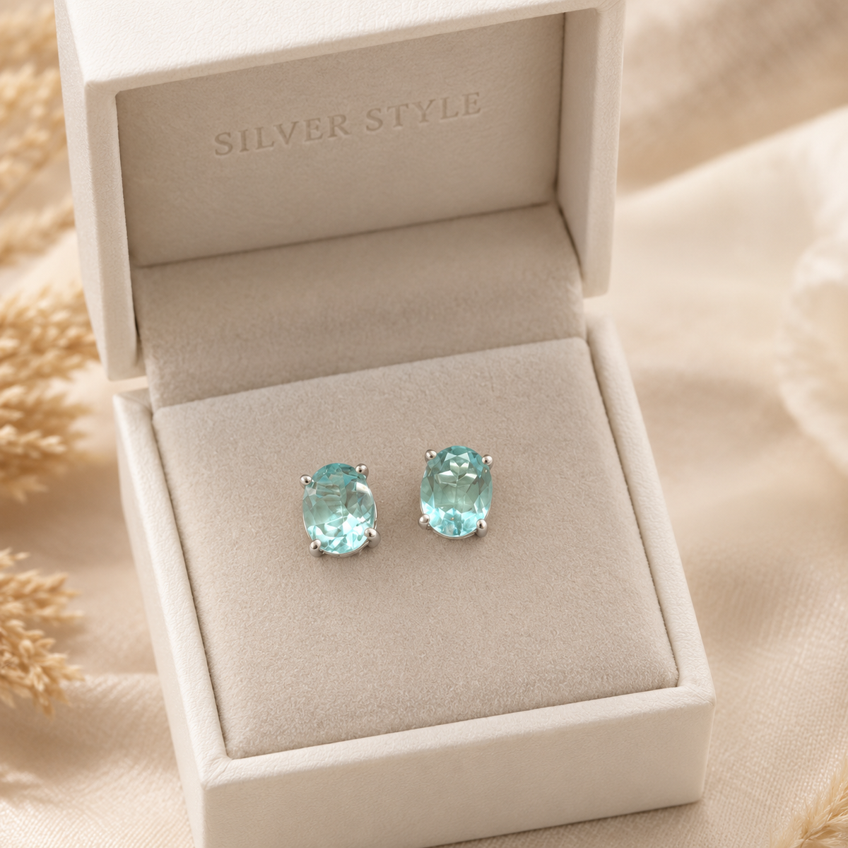 Blue Topaz stud earrings in 925 sterling silver with faceted blue gemstones