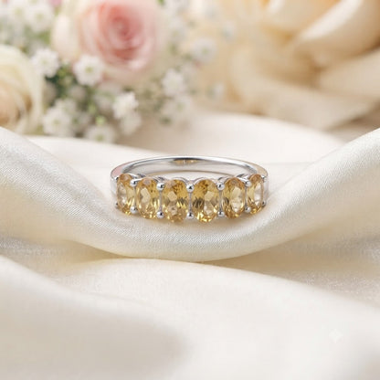 Band Citrine Ring crafted in 925 Sterling Silver featuring five oval cut Citrine gemstones.
