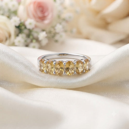 Band Citrine Ring crafted in 925 Sterling Silver featuring five oval cut Citrine gemstones.