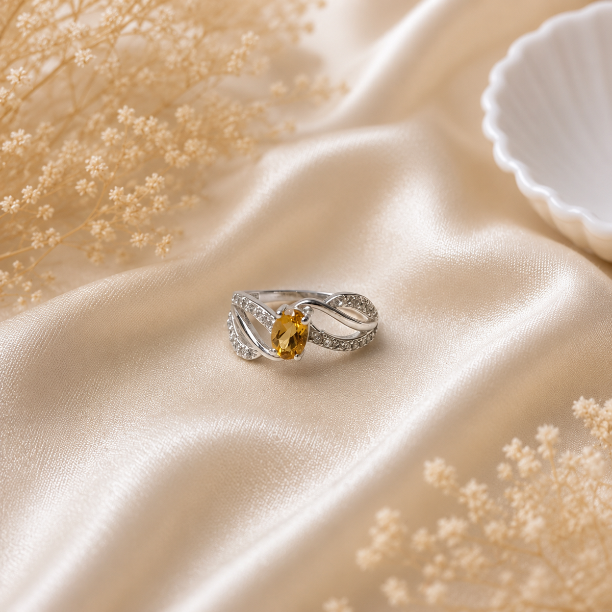 Intertwined Citrine Ring crafted in 925 Sterling Silver with a yellow oval cut Citrine gemstone and detailed silver design.