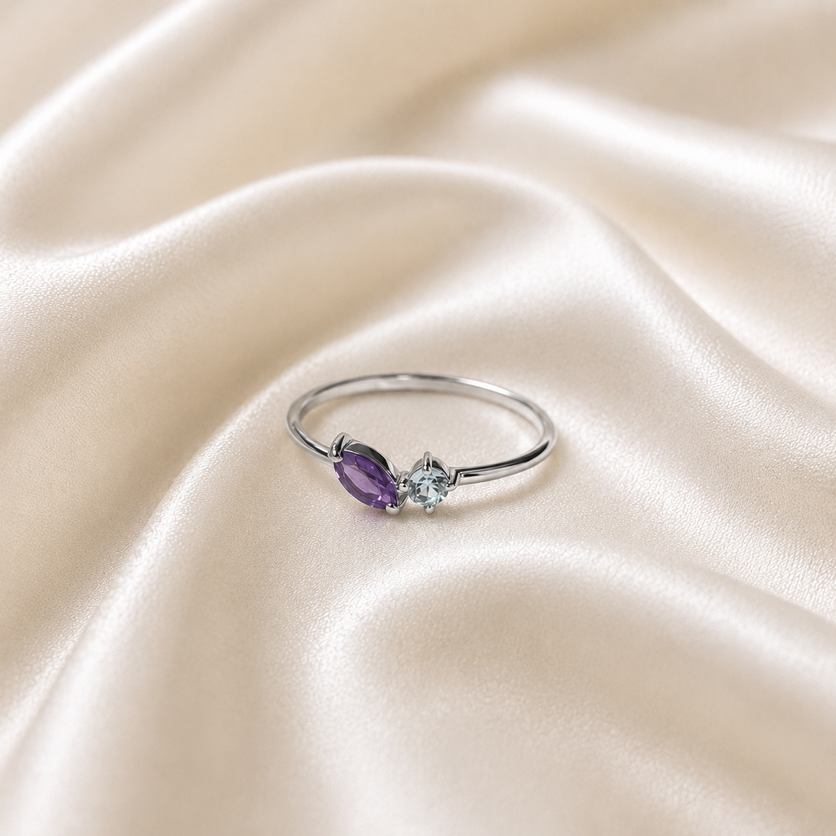Twin Amethyst Ring in 925 Sterling Silver with a marquise purple gemstone and round white accent stone
