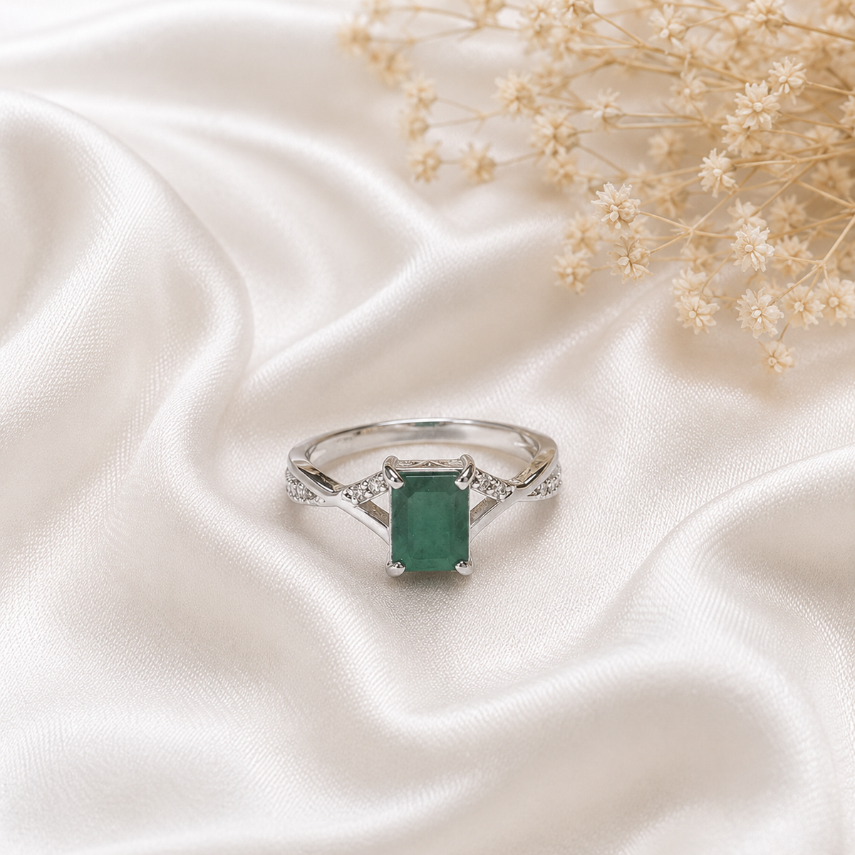 Emerald Solitaire Ring crafted in 925 Sterling Silver with a rectangular green Emerald gemstone.