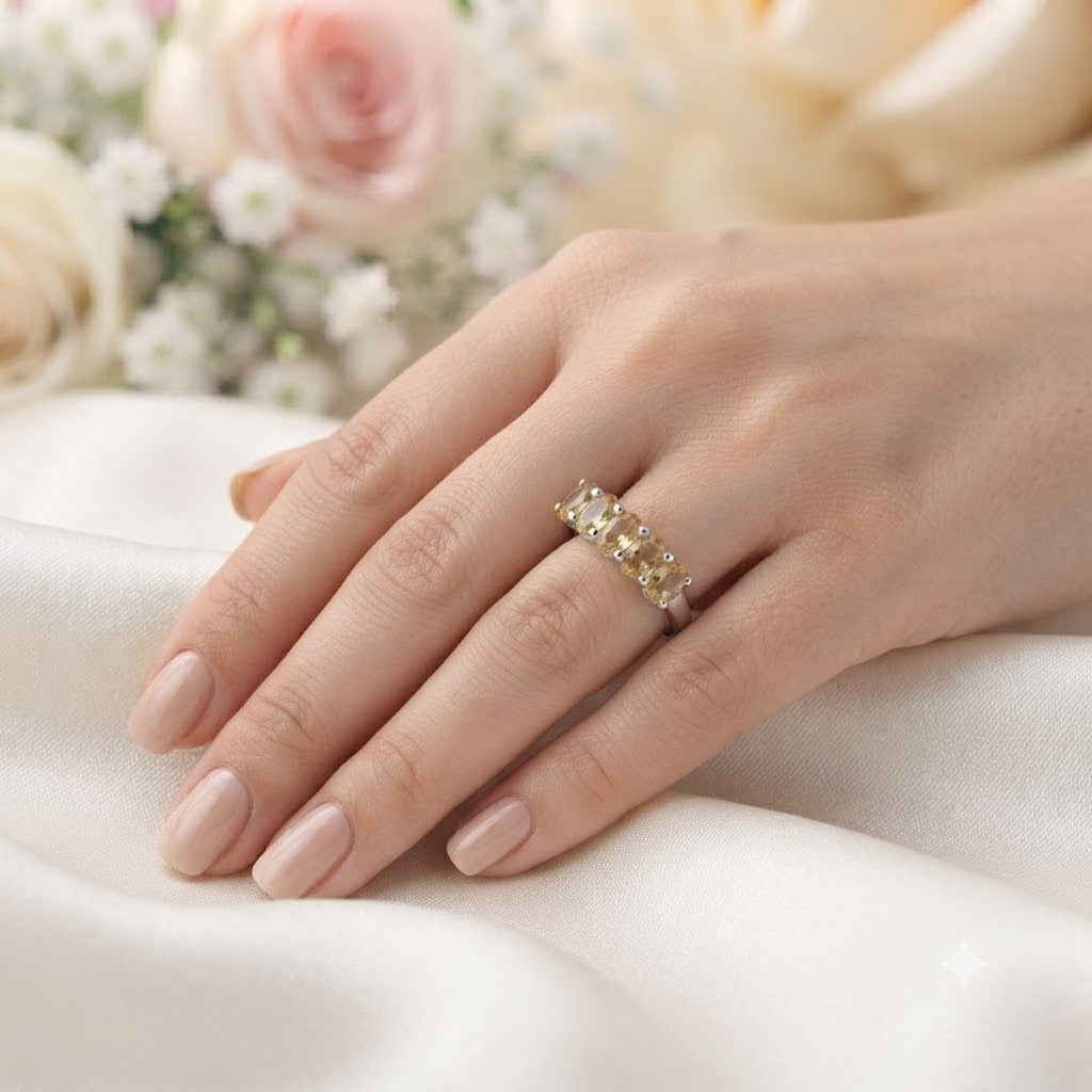 Band Citrine Ring crafted in 925 Sterling Silver featuring five oval cut Citrine gemstones.