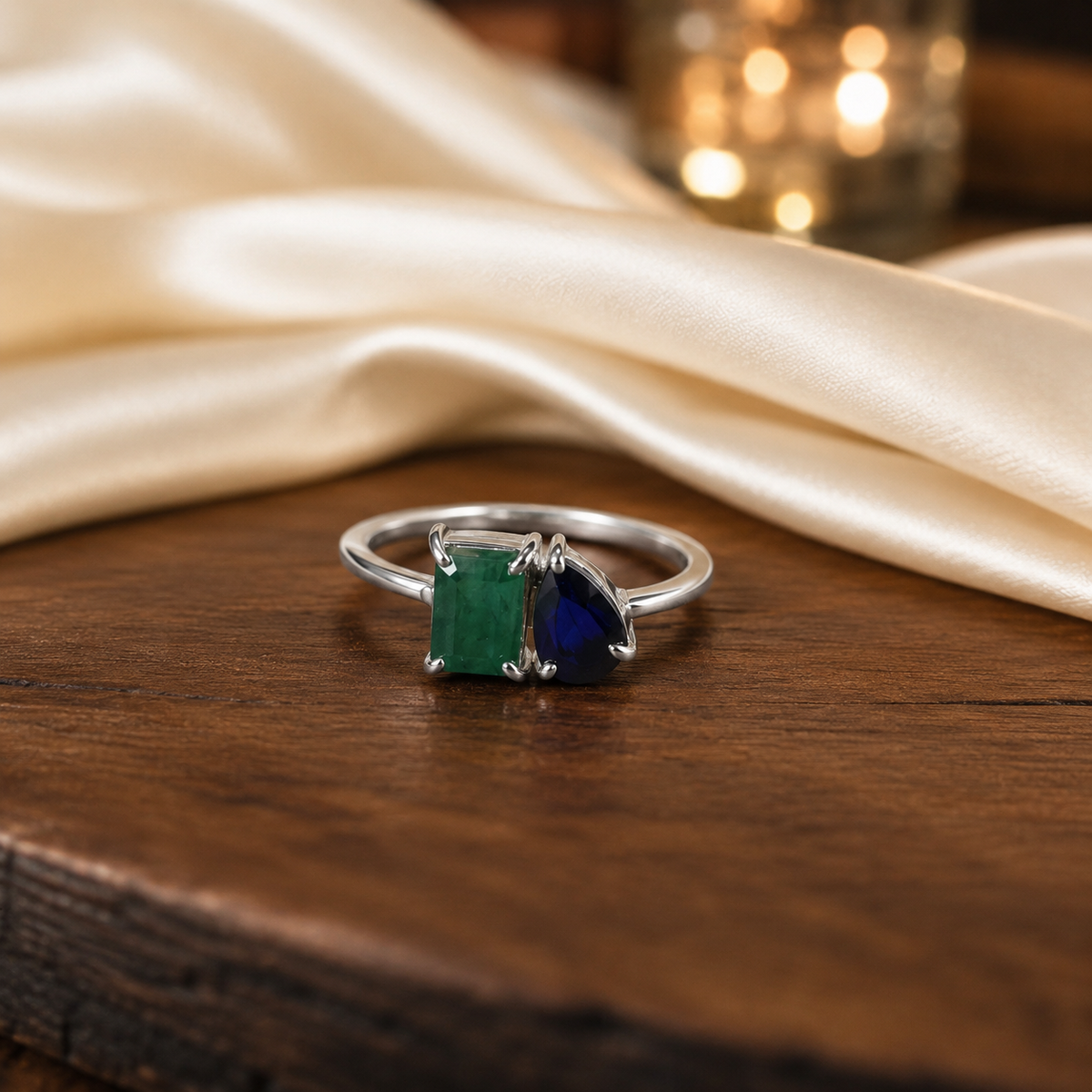 Emerald and Sapphire Ring crafted in 925 Sterling Silver with green and blue gemstones.