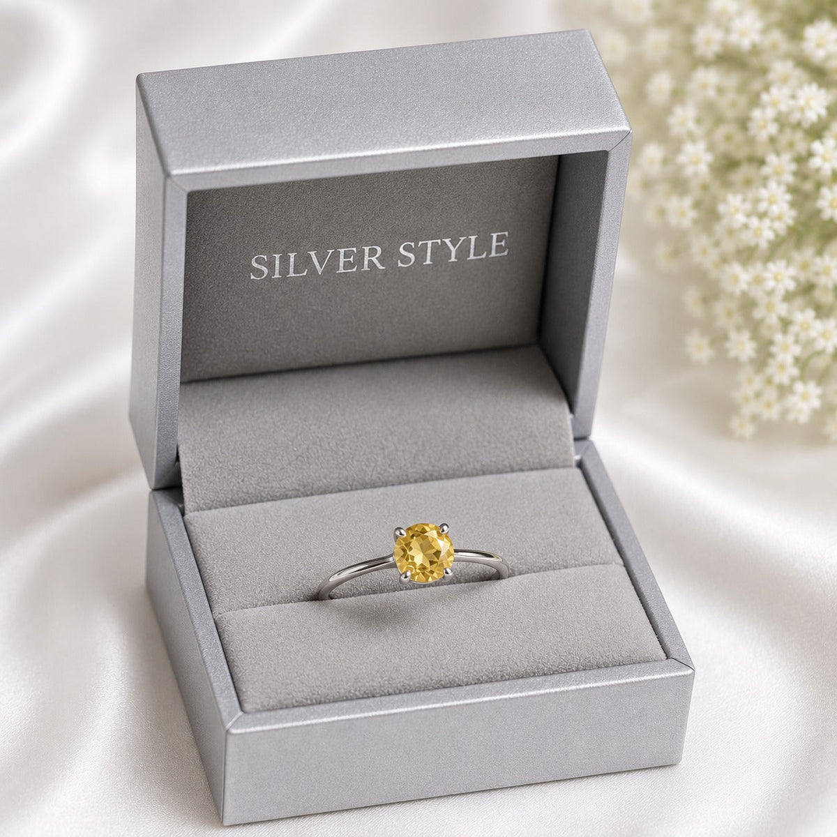 Solitaire Citrine Ring crafted in 925 Sterling Silver featuring a natural round cut Citrine gemstone in a four-prong setting.
