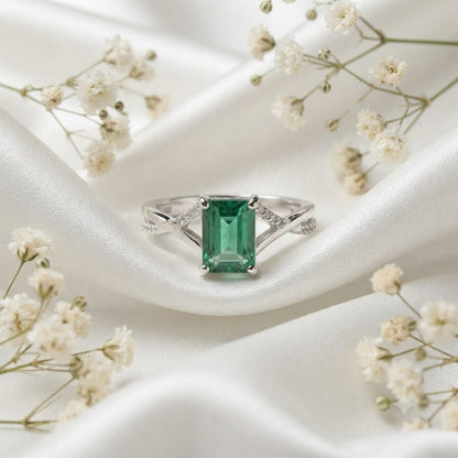 Emerald Solitaire Ring crafted in 925 Sterling Silver with a rectangular green Emerald gemstone.