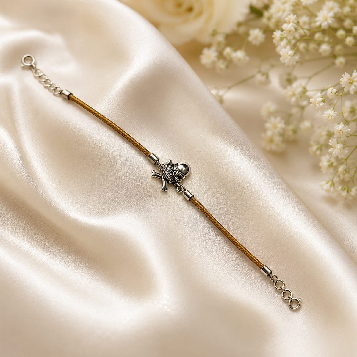 Skull and crossbones charm bracelet on brown cord in 925 Silver