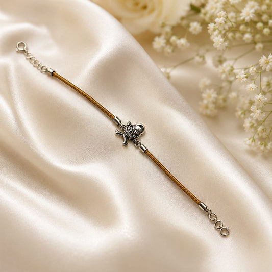 Skull and crossbones charm bracelet on brown cord in 925 Silver