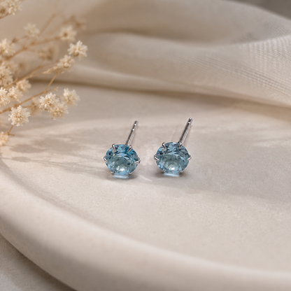 Round Blue Topaz stud earrings in 925 Sterling Silver with six-prong setting