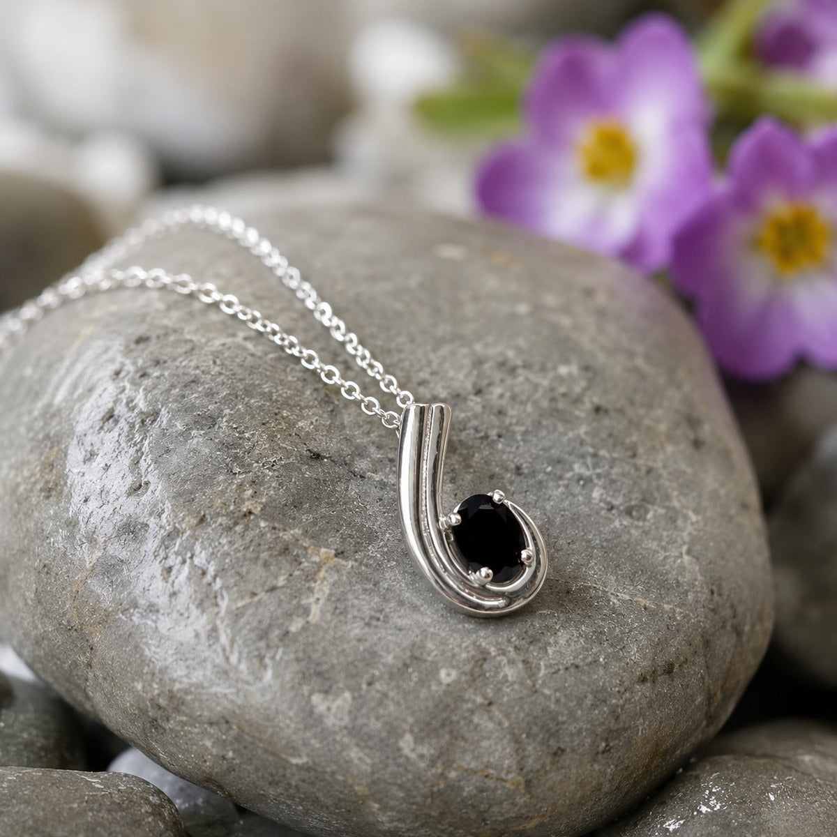 Black Onyx Pendant in 925 Sterling Silver with oval-cut black gemstone.
