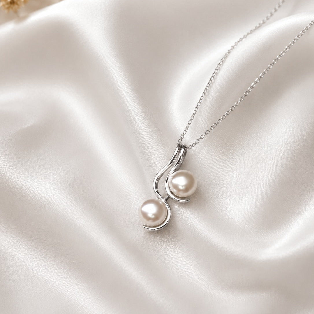 Pearl Drop Pendant in 925 Sterling Silver with lustrous white pearls.