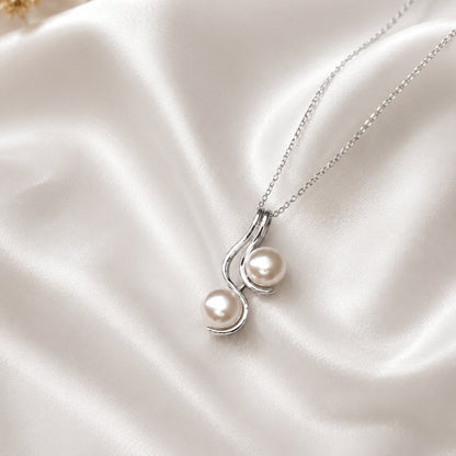 Pearl Drop Pendant in 925 Sterling Silver with lustrous white pearls.