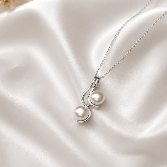 Pearl Drop Pendant in 925 Sterling Silver with lustrous white pearls.