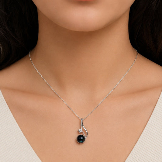 Black Opal Pendant in 925 Sterling Silver with a captivating Black Opal gemstone and sparkling accent stone.