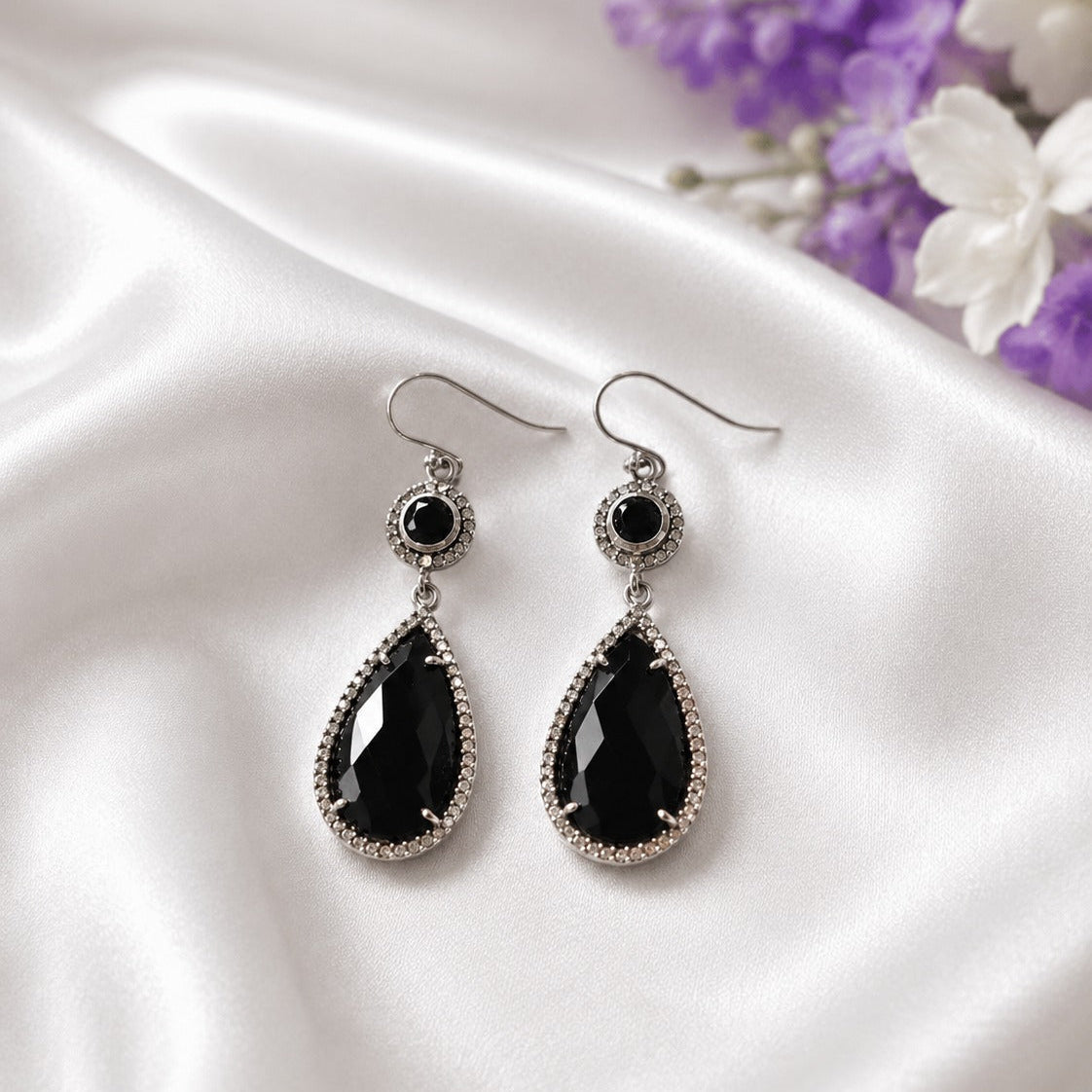 Black Onyx Drop Earrings in 925 Sterling Silver with pear-cut black gemstones.