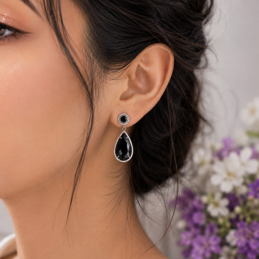 Black Onyx Drop Earrings in 925 Sterling Silver with pear-cut black gemstones.