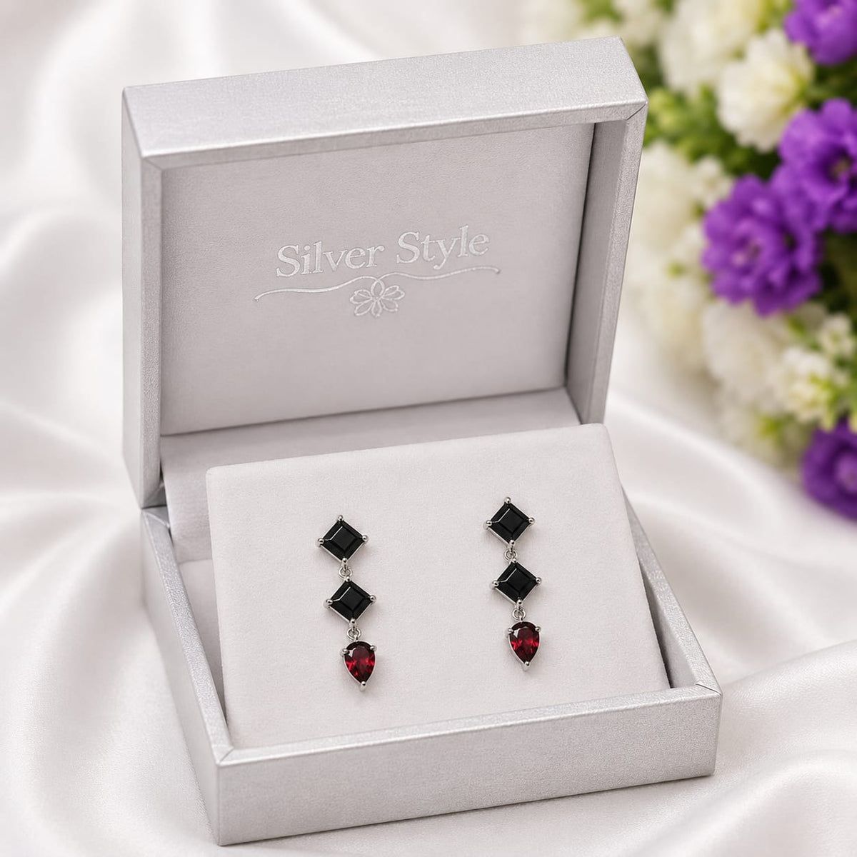 Black Onyx & Labradorite Drop Earrings in 925 Sterling Silver featuring square-cut Black Onyx and pear-cut Labradorite gemstones.