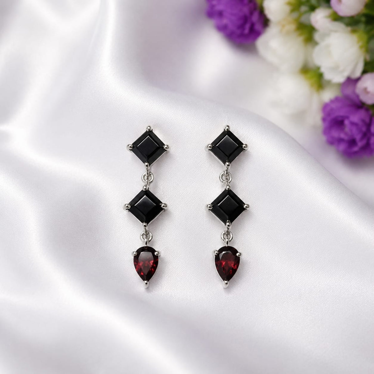 Black Onyx & Labradorite Drop Earrings in 925 Sterling Silver featuring square-cut Black Onyx and pear-cut Labradorite gemstones.