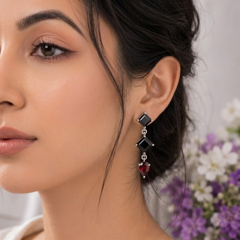 Black Onyx & Labradorite Drop Earrings in 925 Sterling Silver featuring square-cut Black Onyx and pear-cut Labradorite gemstones.