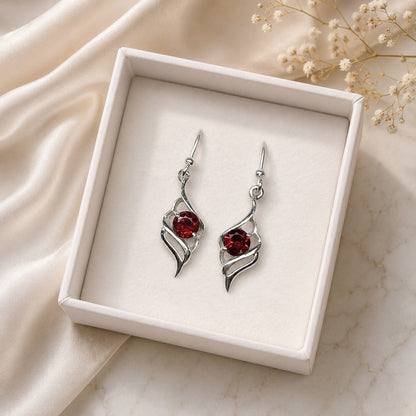925 Sterling Silver Swirl Drop Earrings featuring round-cut Garnet gemstones in an elegant openwork design.