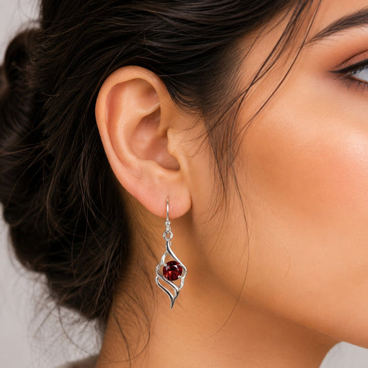 925 Sterling Silver Swirl Drop Earrings featuring round-cut Garnet gemstones in an elegant openwork design.