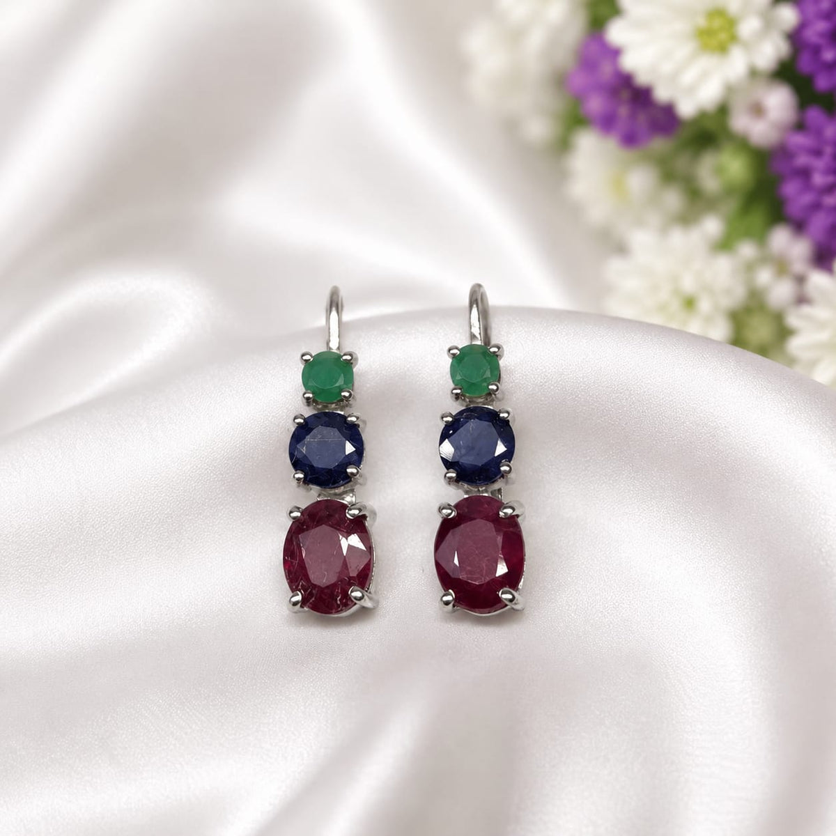 925 Sterling Silver Drop Earrings featuring Emerald, Blue Sapphire, and Ruby gemstones in a vertical three-stone design.