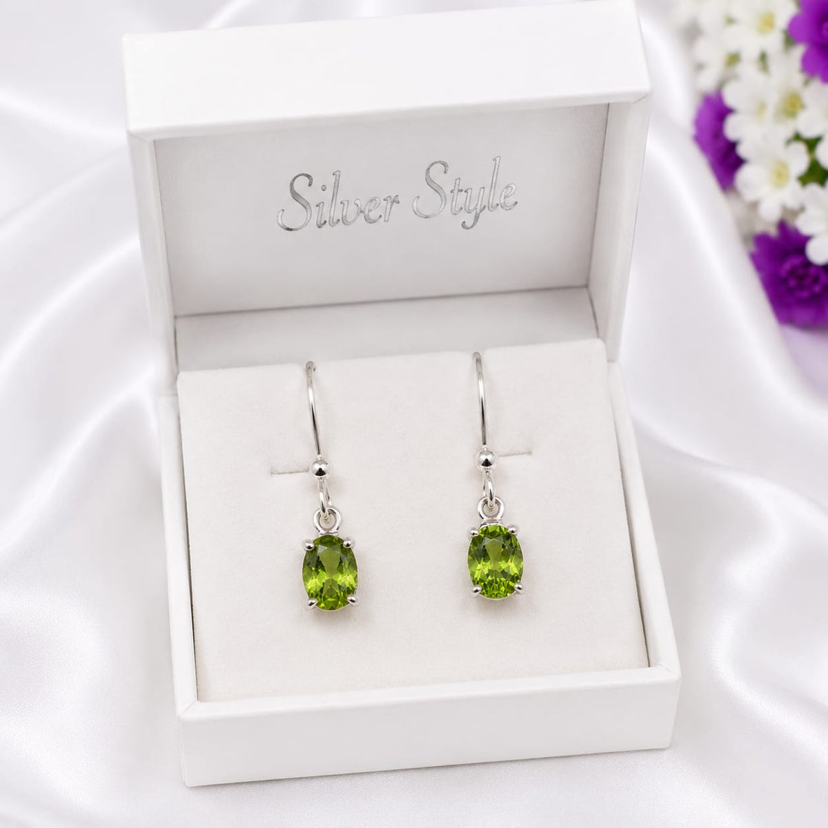 925 Sterling Silver Solitaire Drop Earrings featuring natural oval-cut Peridot gemstones in a classic minimalist setting.